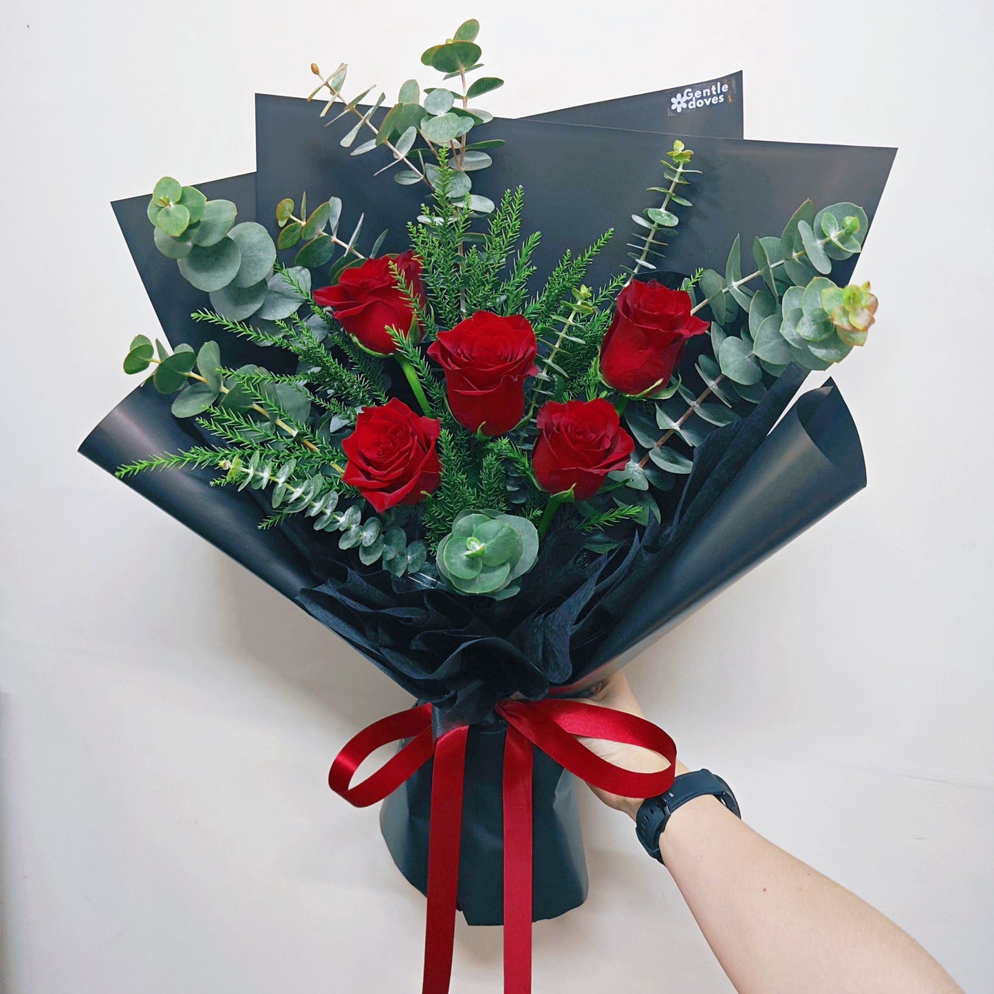 Five Imported Red Roses with Green Foliage in Black Paper Medium Size Bouquet