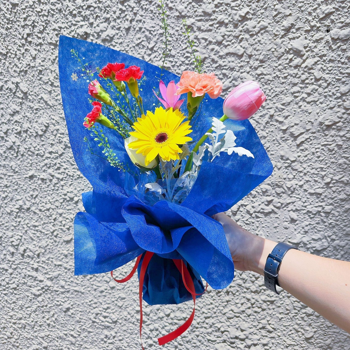 Assorted Colorful Flowers with Tulip in Blue Contrast Paper Bouquet