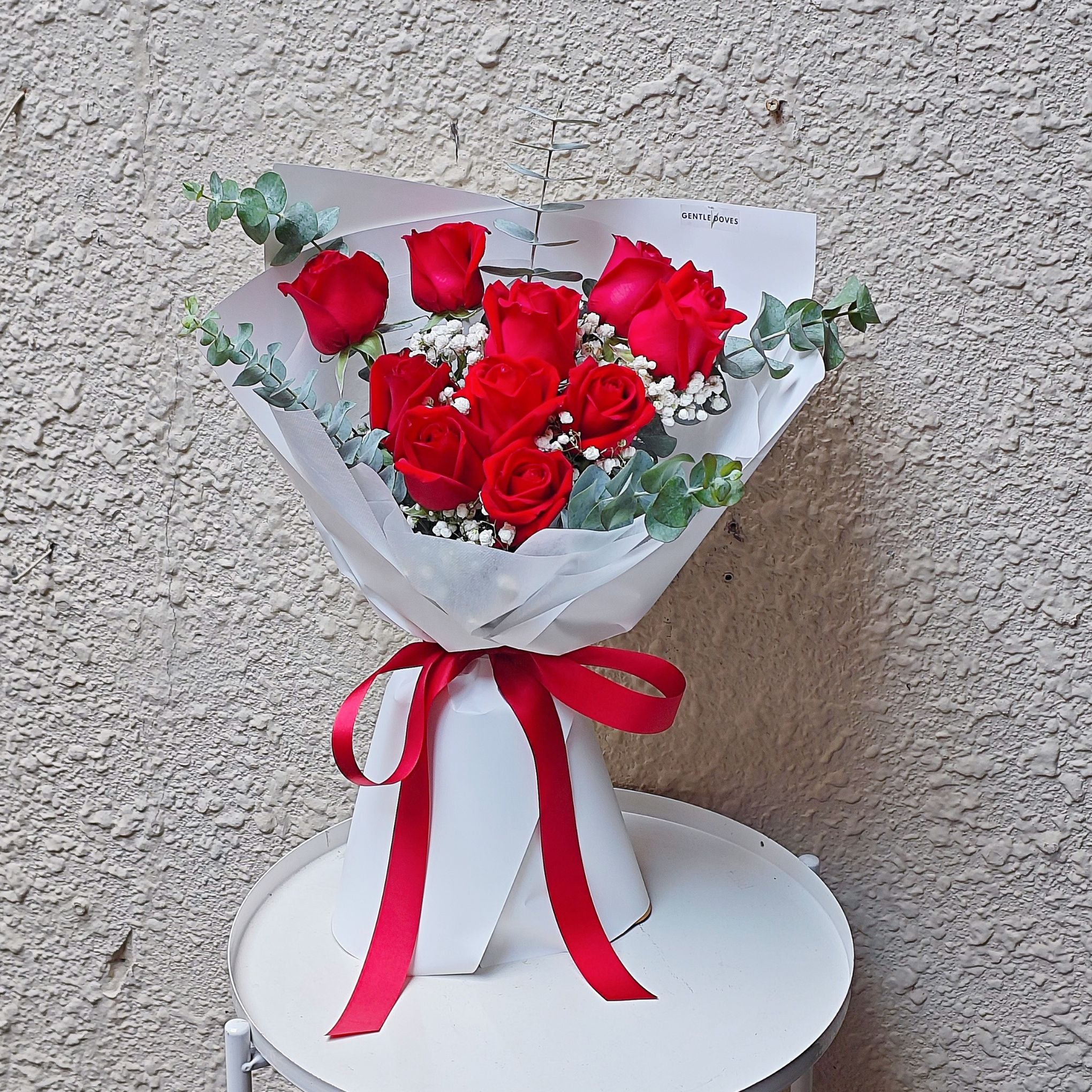 Ten Red Roses with Gypsophila and Eucalyptus in Open Wrapping Style Bo ...