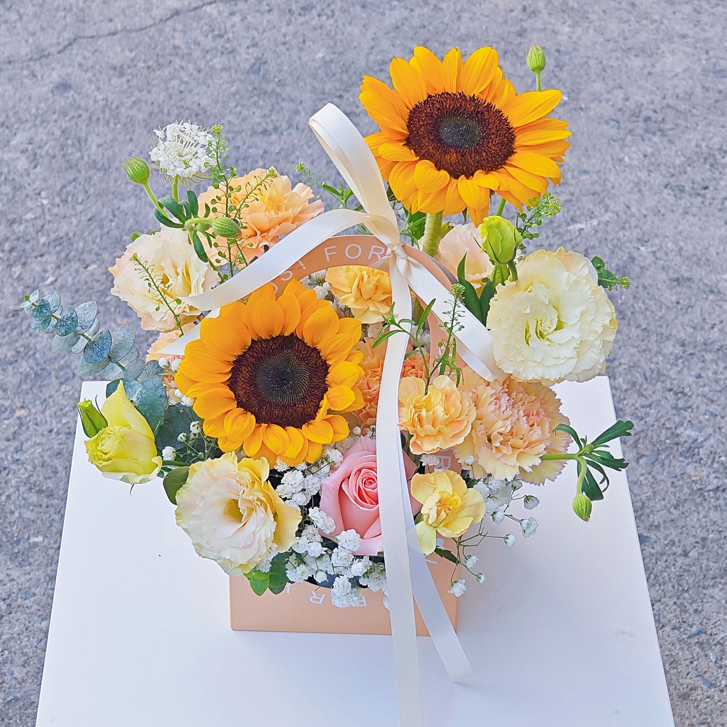 Assorted Yellow Flowers with Sunflowers in Carrying Mini Box Arrangement