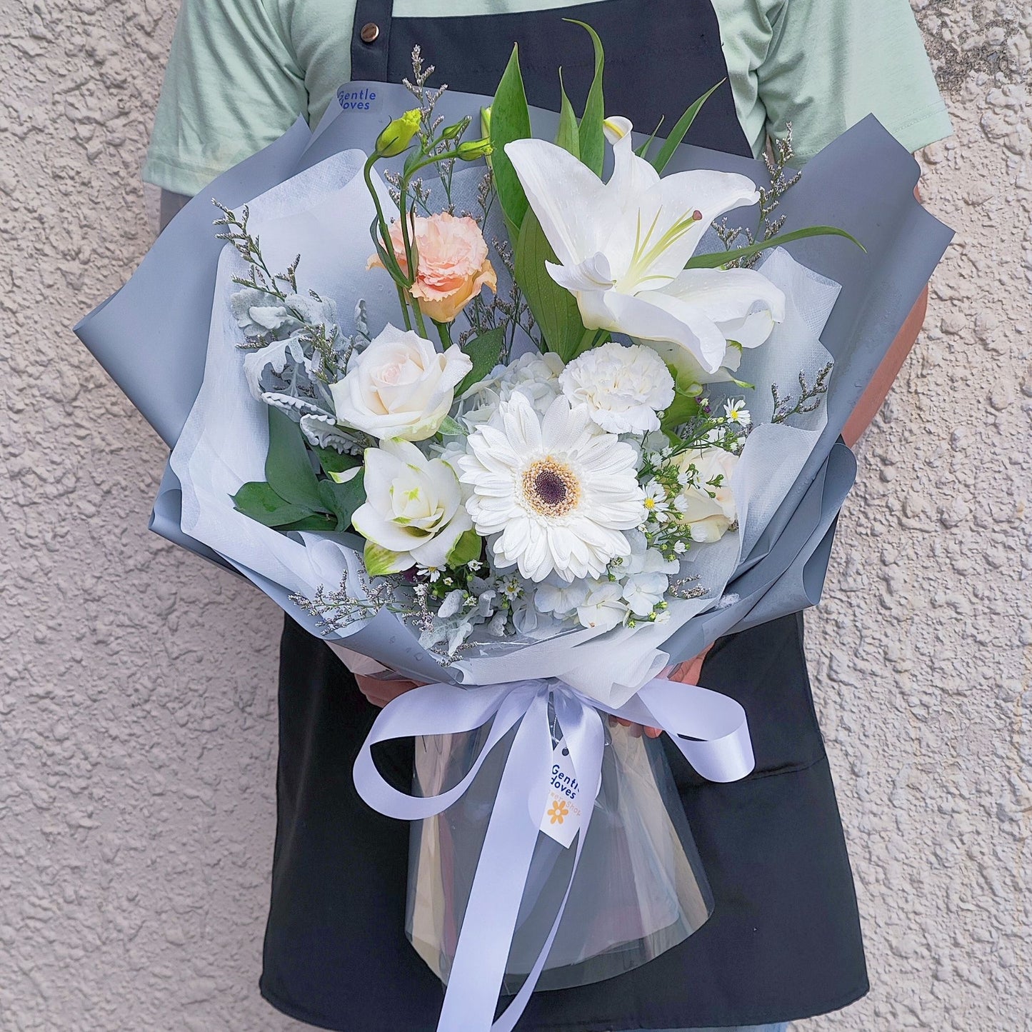 Assorted White Flowers in Gray Paper Bouquet