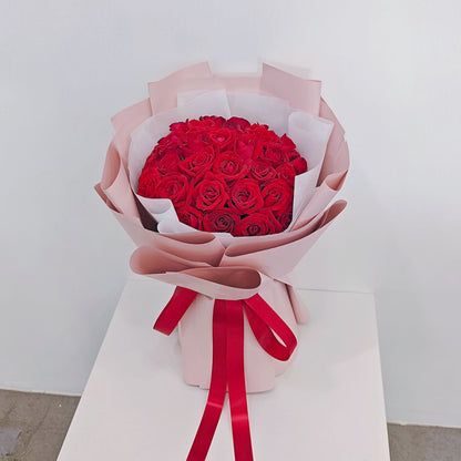 Thirty Red Roses in Pink Paper Bouquet
