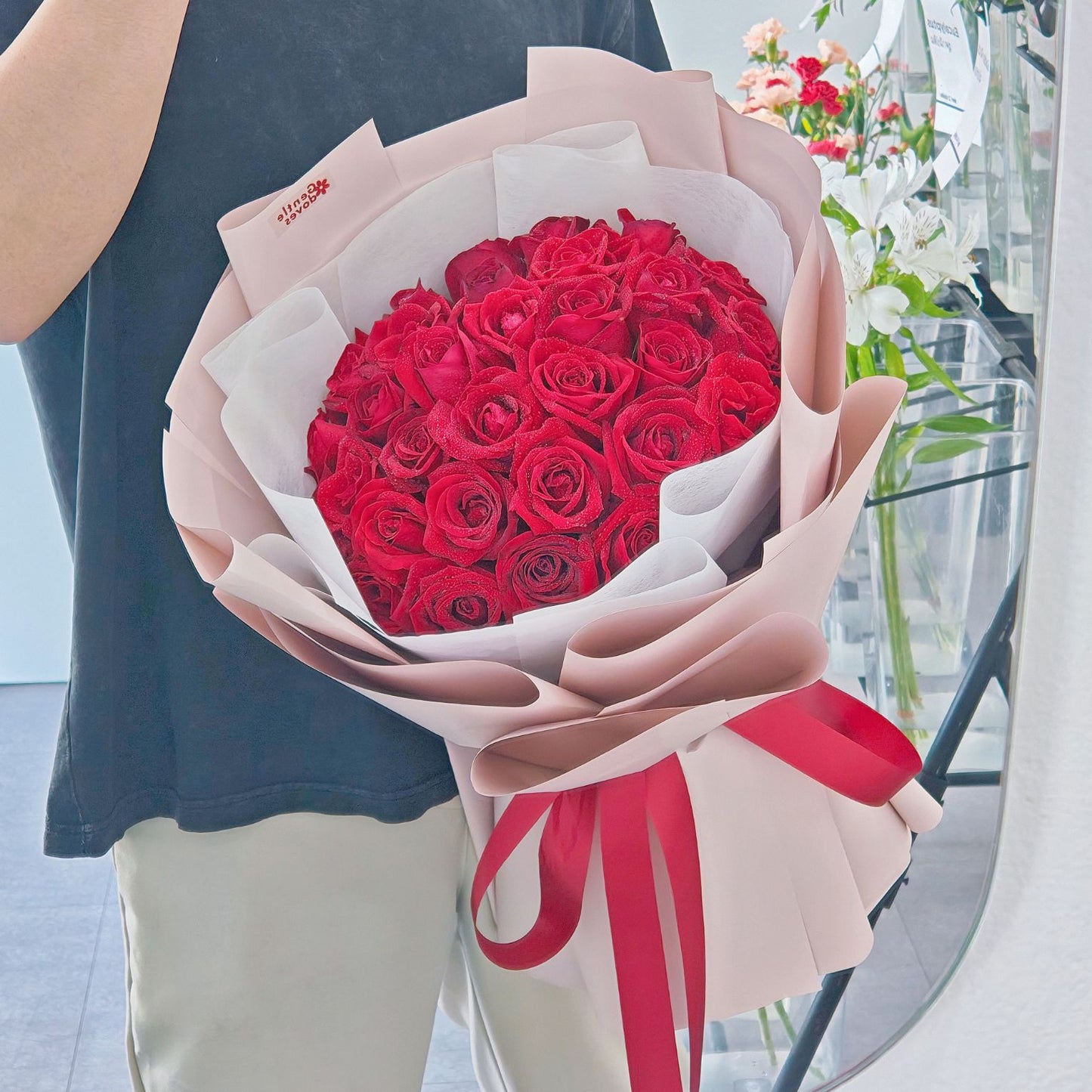 Thirty Red Roses in Pink Paper Bouquet