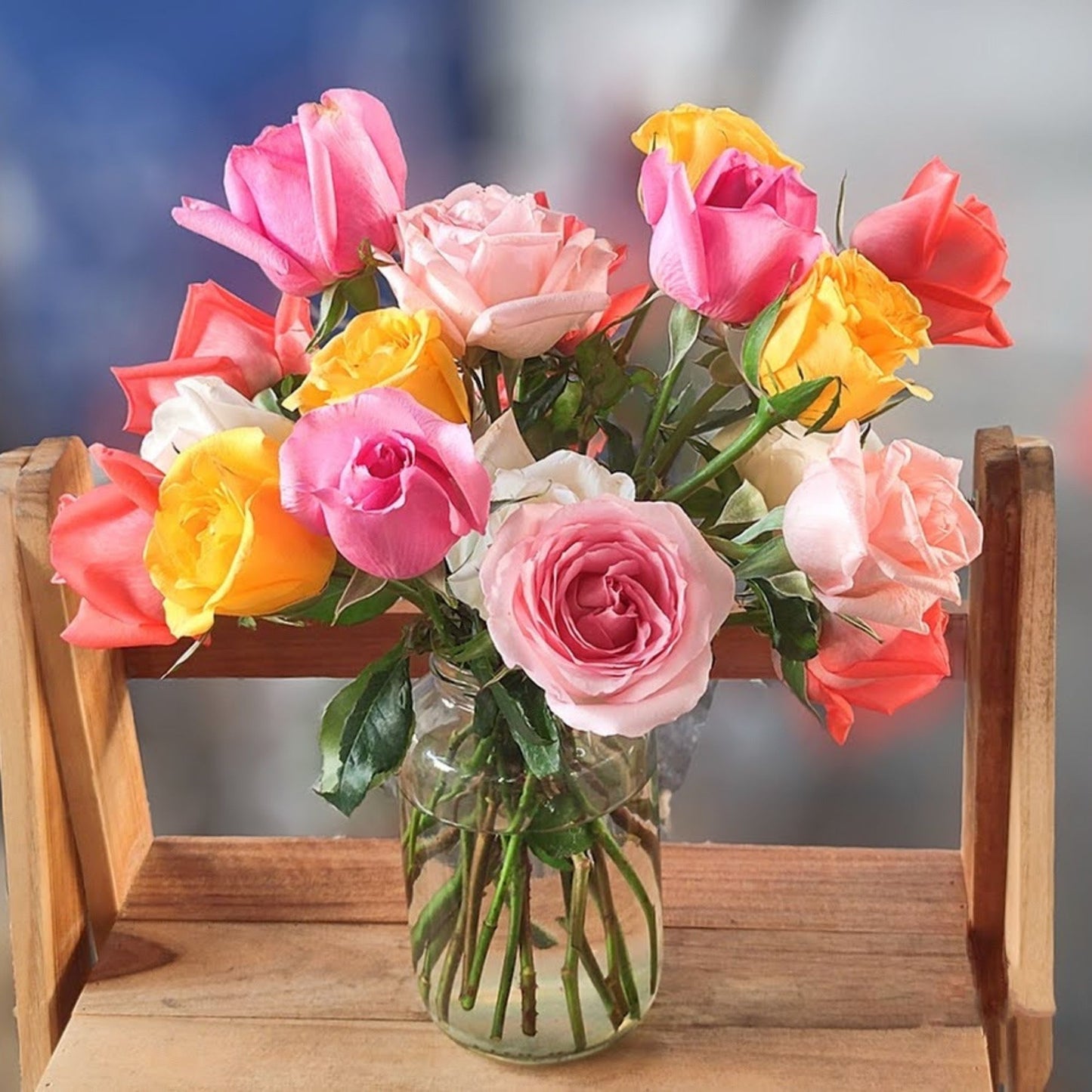 Eighteen Assorted Color Roses in Medium Vase Arrangement