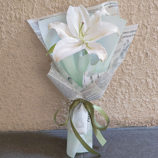 Single White Lily in Newspaper Bouquet