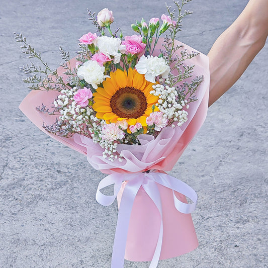 Single Sunflower with Carnations and Filler Flowers in Pink Paper Bouquet