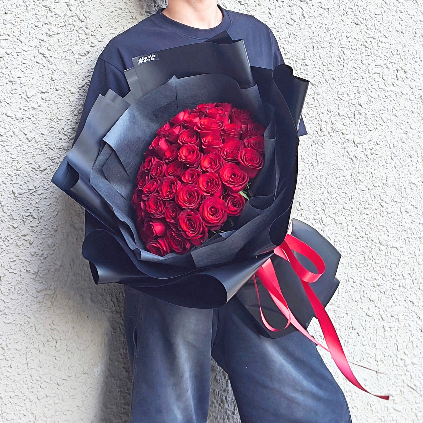 Imported Fifty Red Roses in Black Paper Bouquet