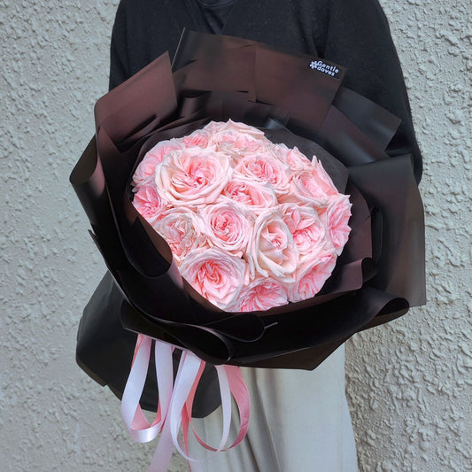 Twenty Soft Pink English Roses in Black Paper Bouquet