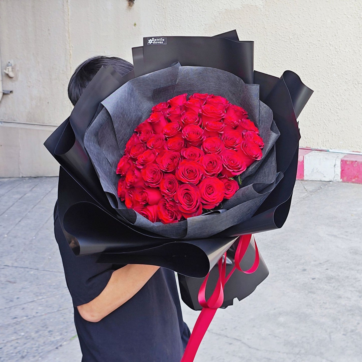 Imported Fifty Red Roses in Black Paper Bouquet