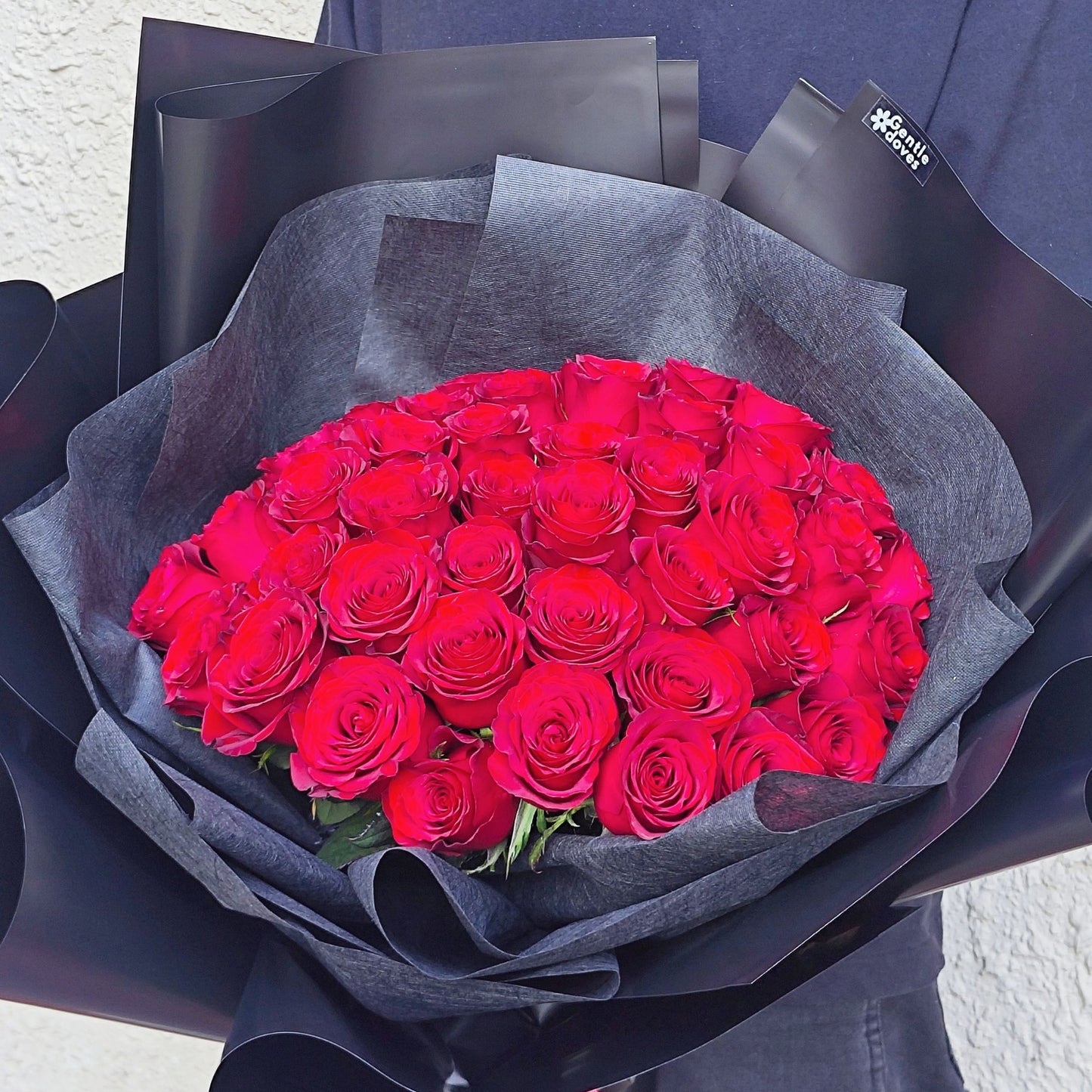 Imported Fifty Red Roses in Black Paper Bouquet