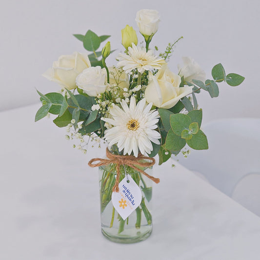 Assorted White Roses and Gerberas with Green Foliage in Small Vase Arrangement