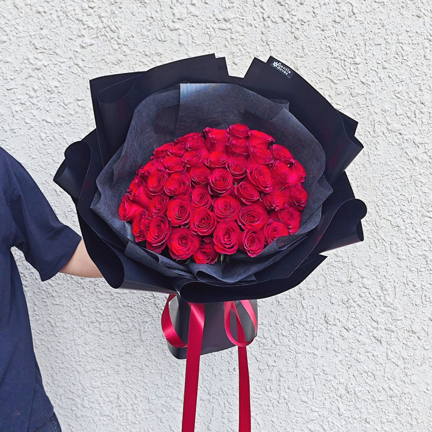 Imported Fifty Red Roses in Black Paper Bouquet