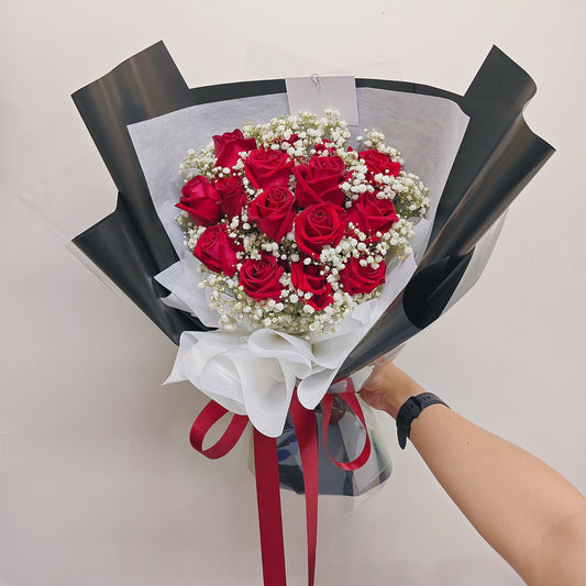 Fifteen Red Roses with Gypsophila in Black Paper Bouquet