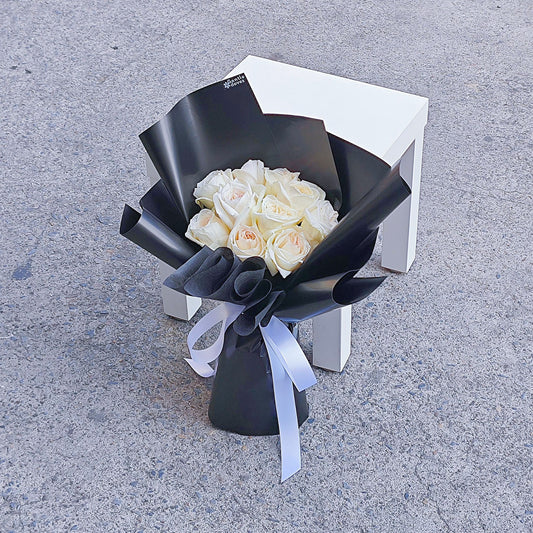 White English Roses in Black Paper Bouquet