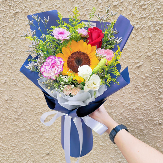 Single Sunflower with Assorted Vivid Flowers in Blue Paper Bouquet