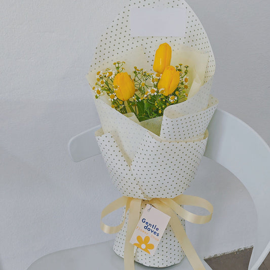 Three Yellow Tulips with Daisies in Dot Pattern Bouquet