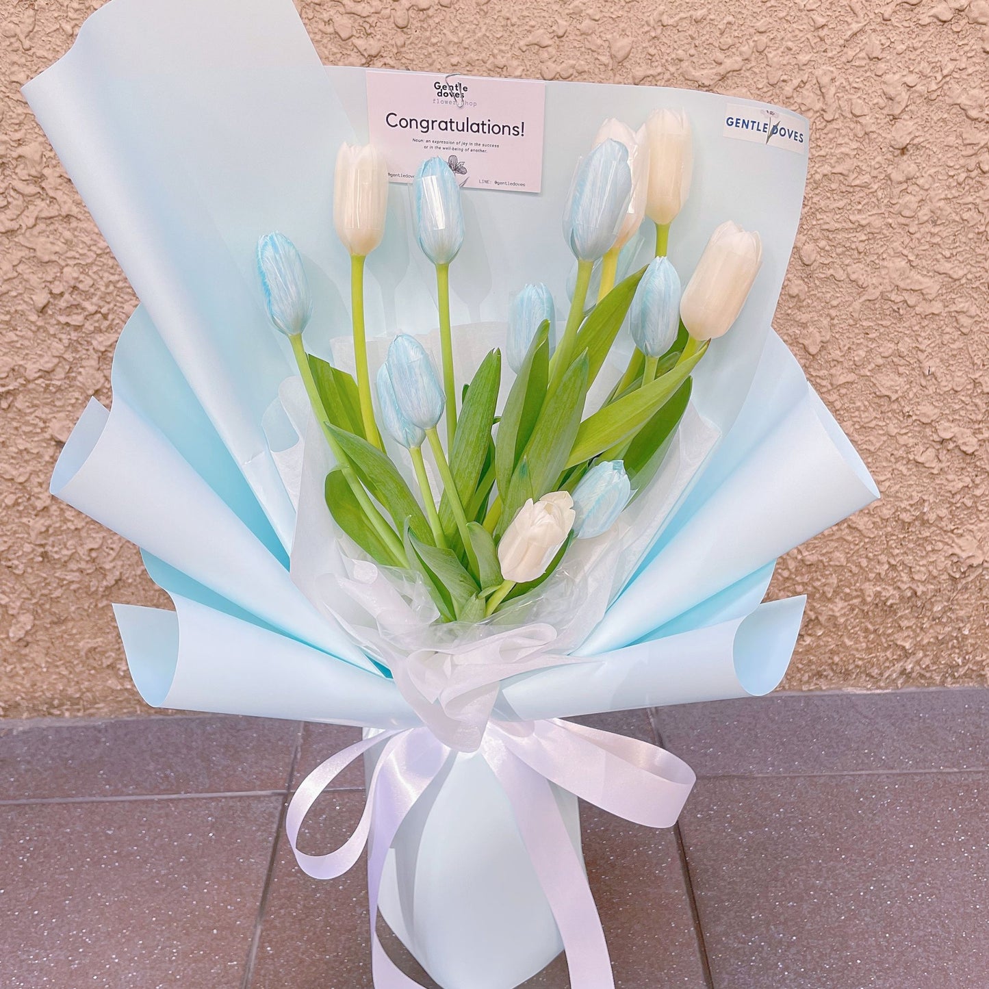 Fourteen Assorted White and Dyed Blue Tulips in Soft Blue Paper Bouquet