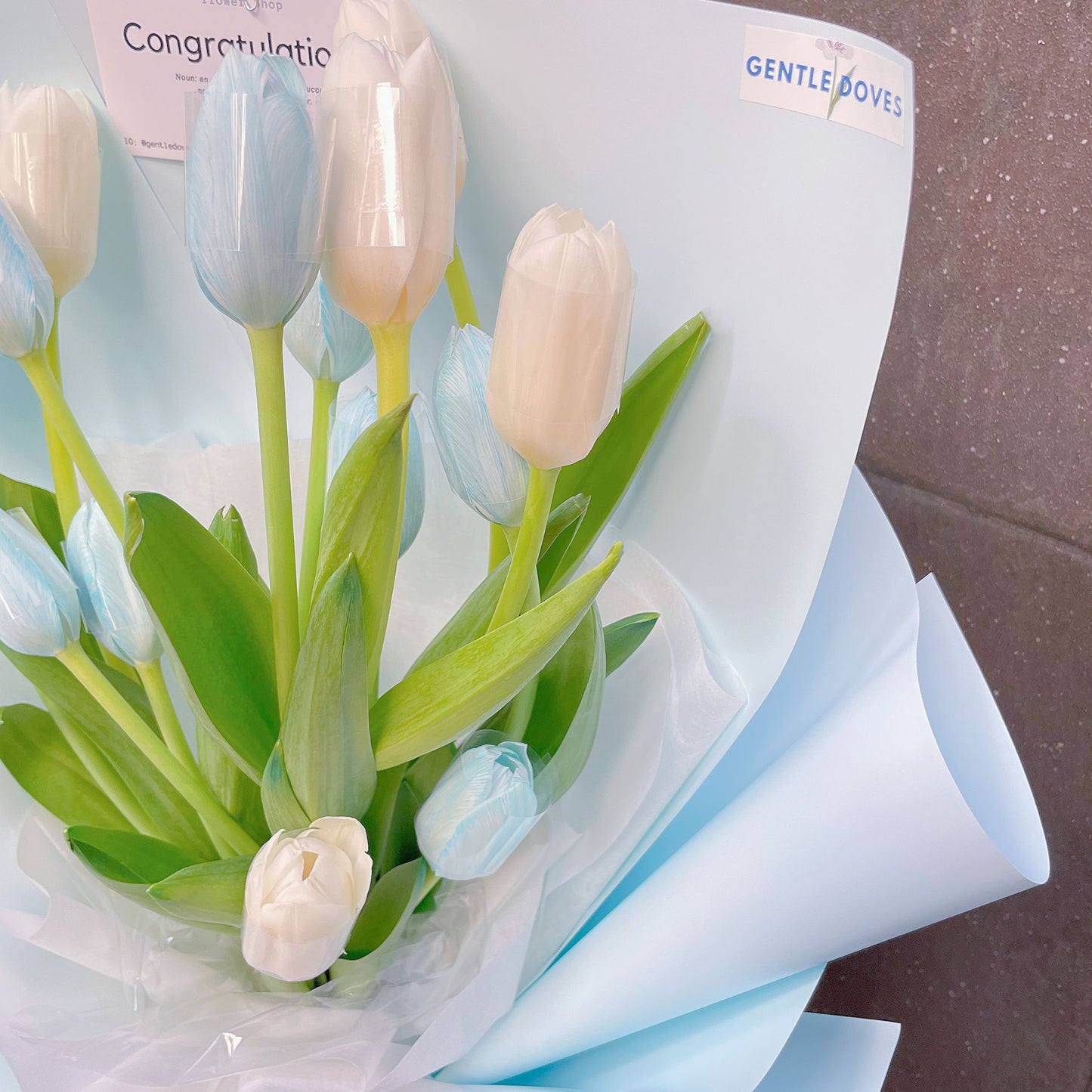 Fourteen Assorted White and Dyed Blue Tulips in Soft Blue Paper Bouquet