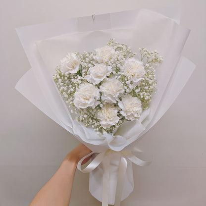 Eight White Carnations with Gypsophila in White Paper Bouquet