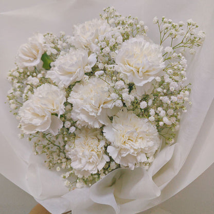 Eight White Carnations with Gypsophila in White Paper Bouquet