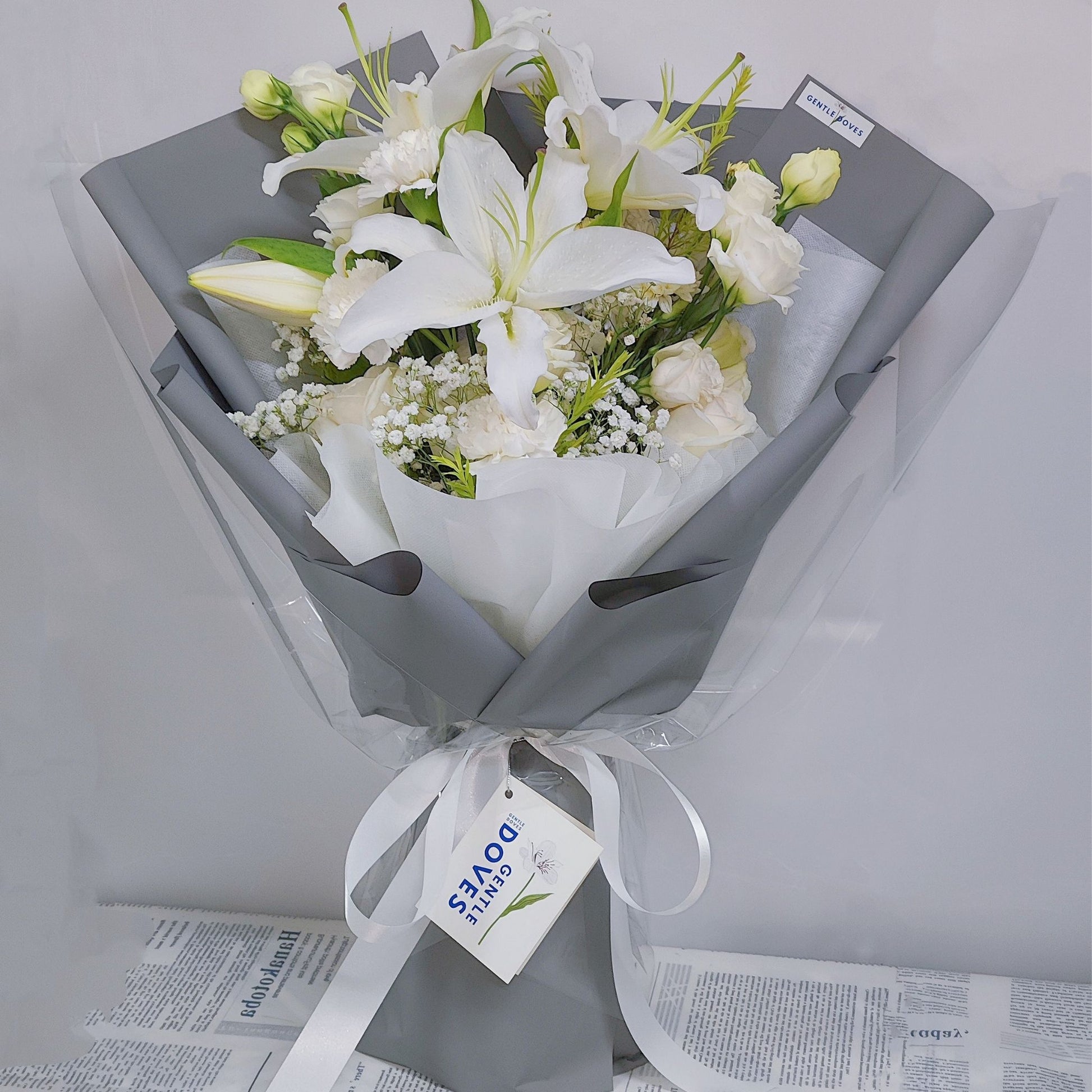 white paper lily White Lilies with Assorted White Flowers in Gray Paper Bouquet – Gentle Doves Flower Shop