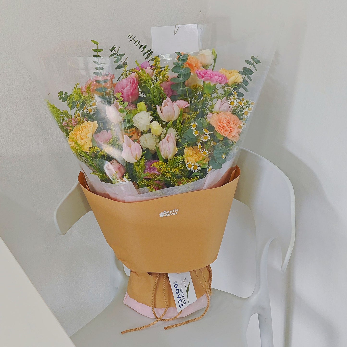 Assorted Flowers in Yellow, Pink and Orange with Pink Tulips Minimal Style Bouquet