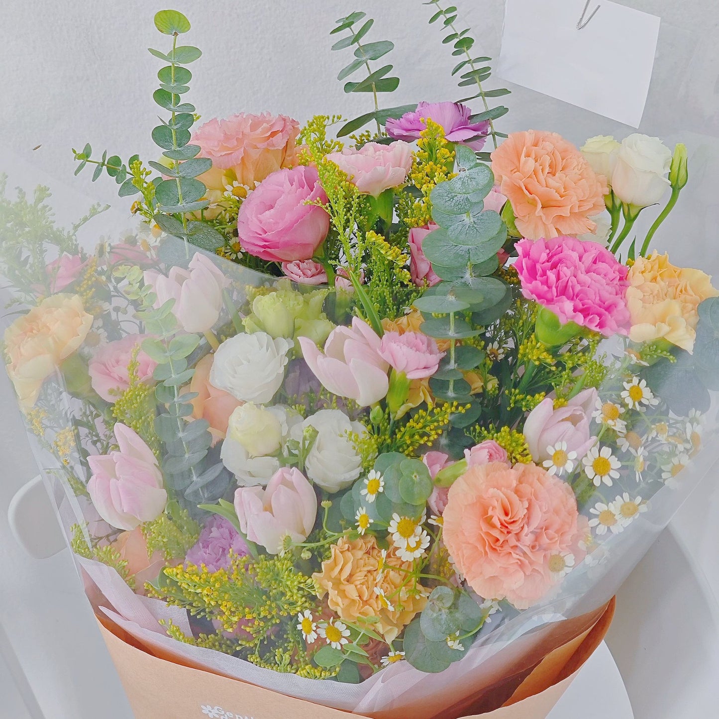 Assorted Flowers in Yellow, Pink and Orange with Pink Tulips Minimal Style Bouquet
