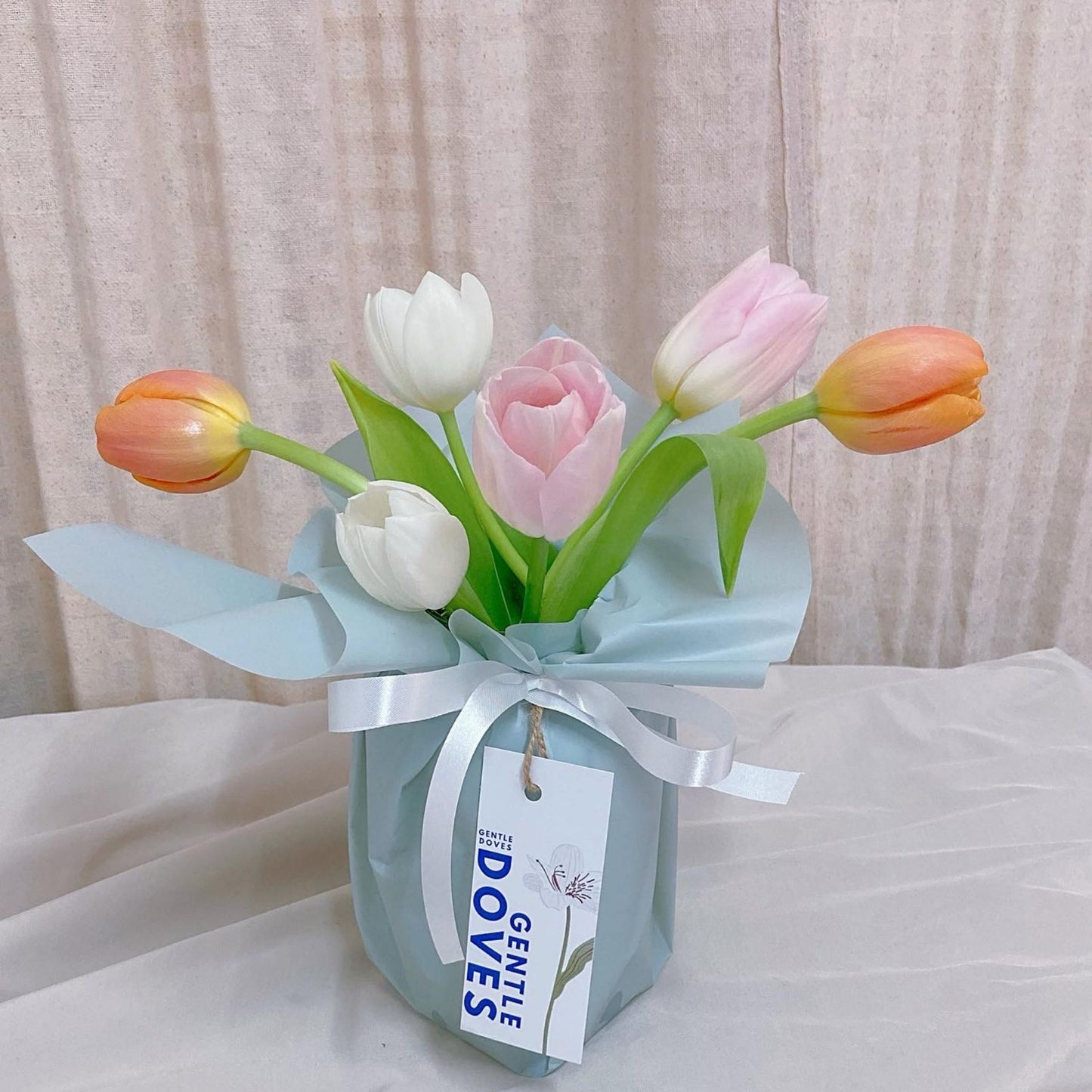 Six Assorted Colorful Tulips in Medium Vase Arrangement