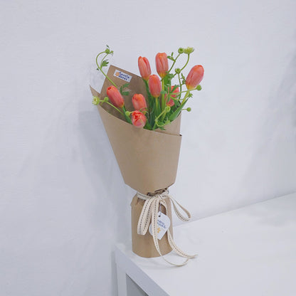 Eight Orange Tulips with Green Foliage in Kraft Paper Bouquet
