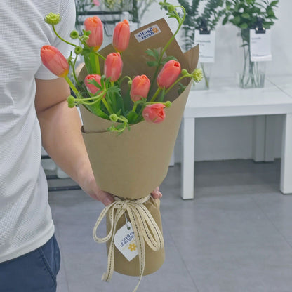 Eight Orange Tulips with Green Foliage in Kraft Paper Bouquet