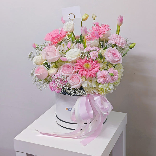 Assorted Pastel Pink and White Flowers in Medium Box Arrangement.