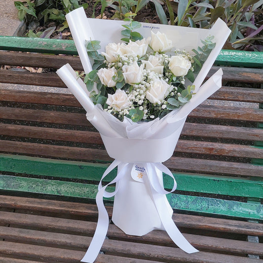 Nine White Roses with Gypsophila and Eucalyptus in White Paper Bouquet