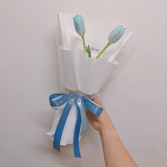 Two Dyed Blue Tulips in White Paper Minimal Bouquet