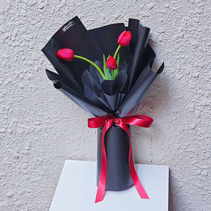 Red Tulips in Black Paper Bouquet