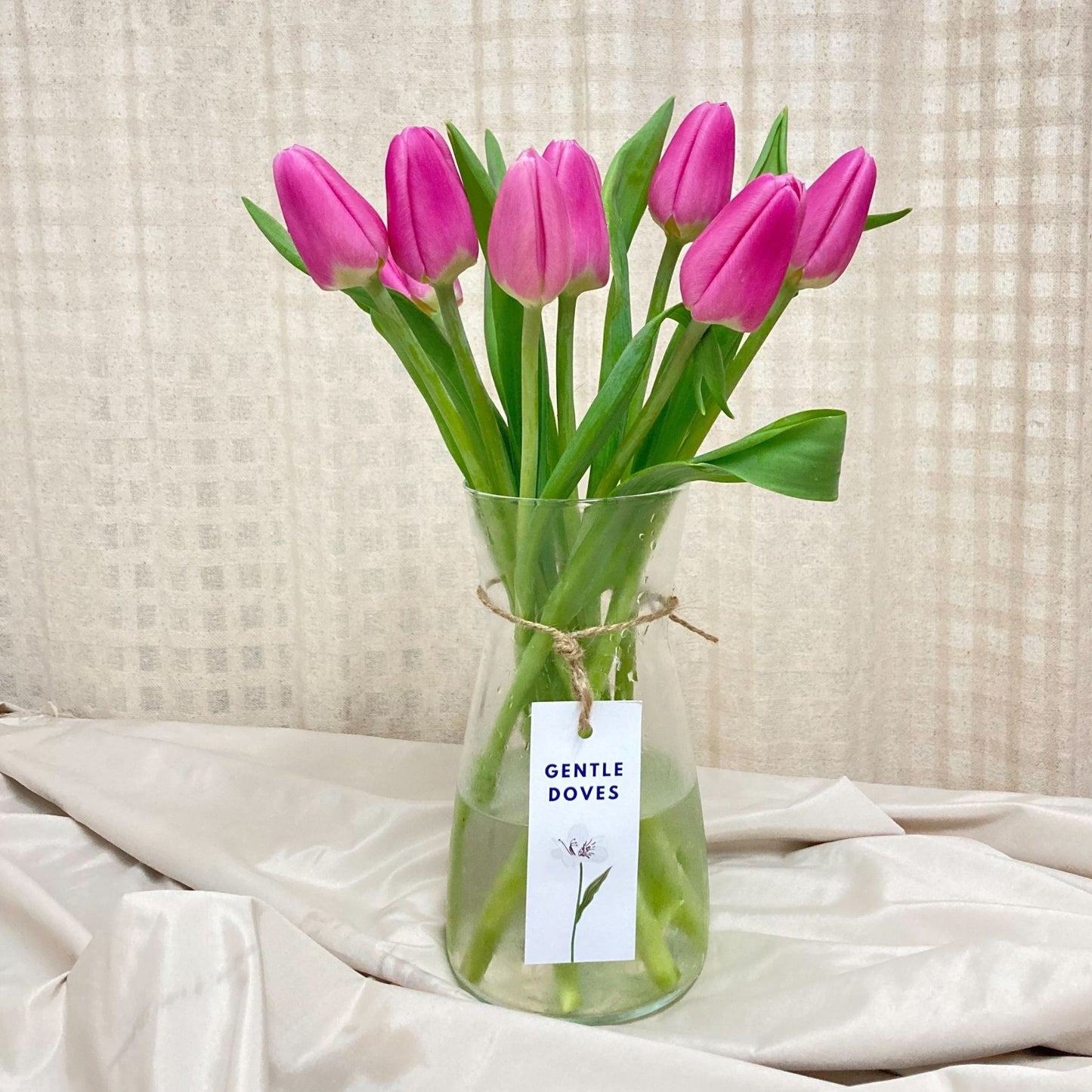 Nine Vivid Pink Tulips in Large Vase Arrangement