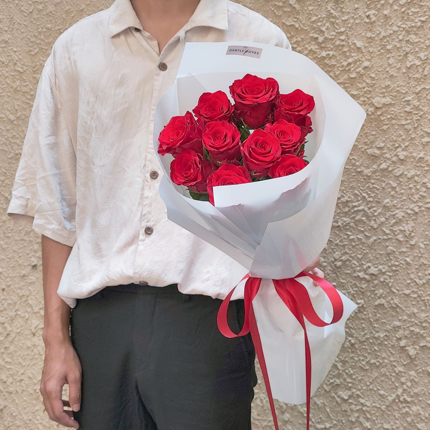 Ten Imported Red Roses in White Paper Bouquet