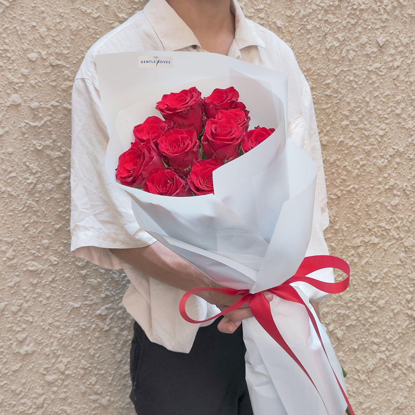 Ten Imported Red Roses in White Paper Bouquet