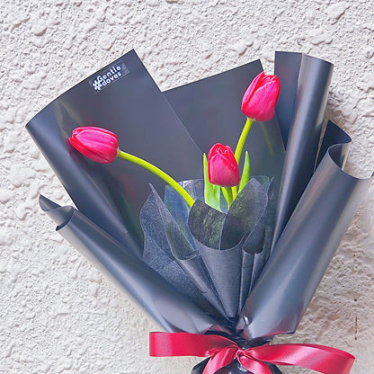 Red Tulips in Black Paper Bouquet