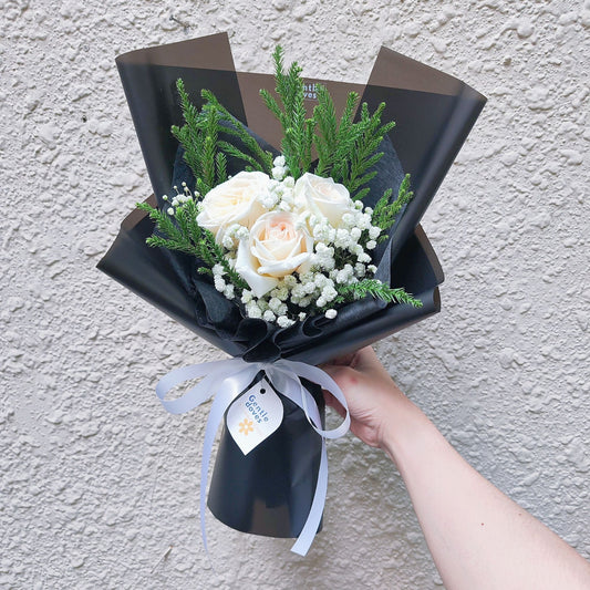 Three White English Roses with Gypsophila and Sugi Pines in Black Paper Bouquet