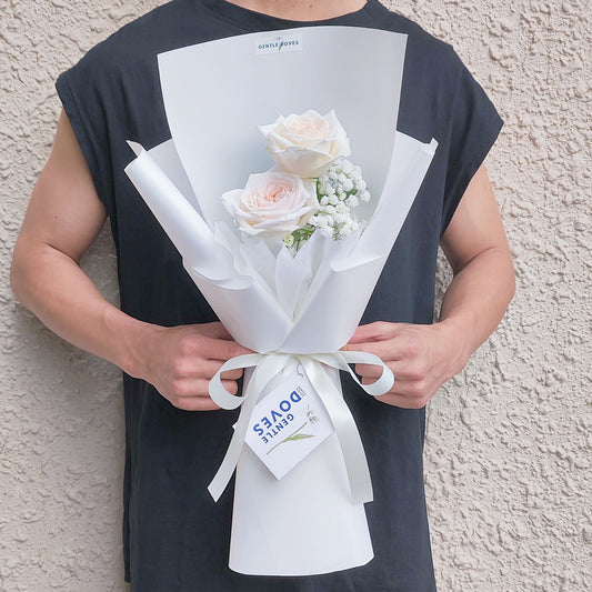 Two White English Roses with Gypsophila in White Paper Bouquet