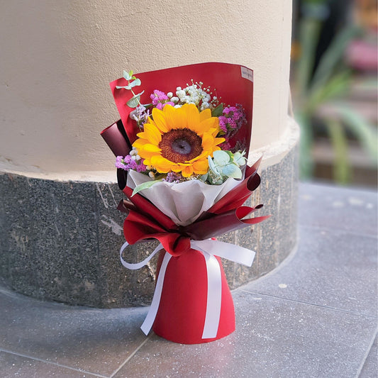 Single Sunflower with Assorted Flowers in Red Paper Small Bouquet