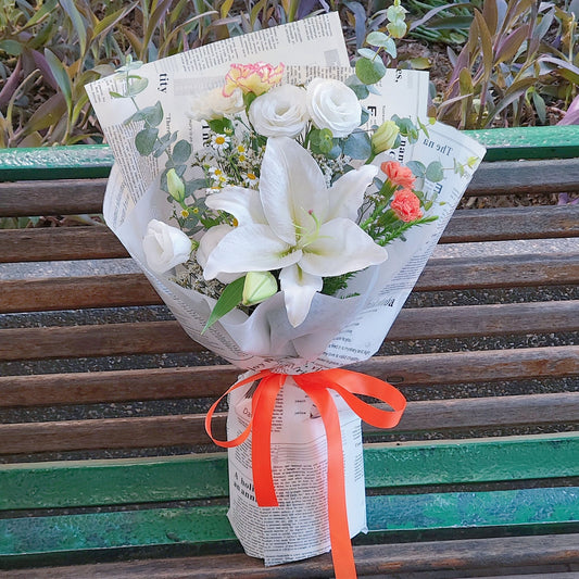 White Lilies with Orange Contrast Flowers in Newspaper Bouquet