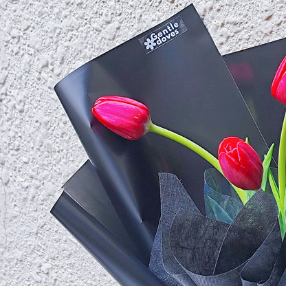 Red Tulips in Black Paper Bouquet