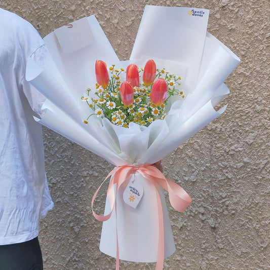 Five Orange Tulips with Daisies in White Paper Bouquet