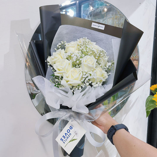 Ten White Roses with Gypsophila in Black Paper Bouquet