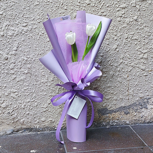 Two White Tulips in Purple Paper Bouquet