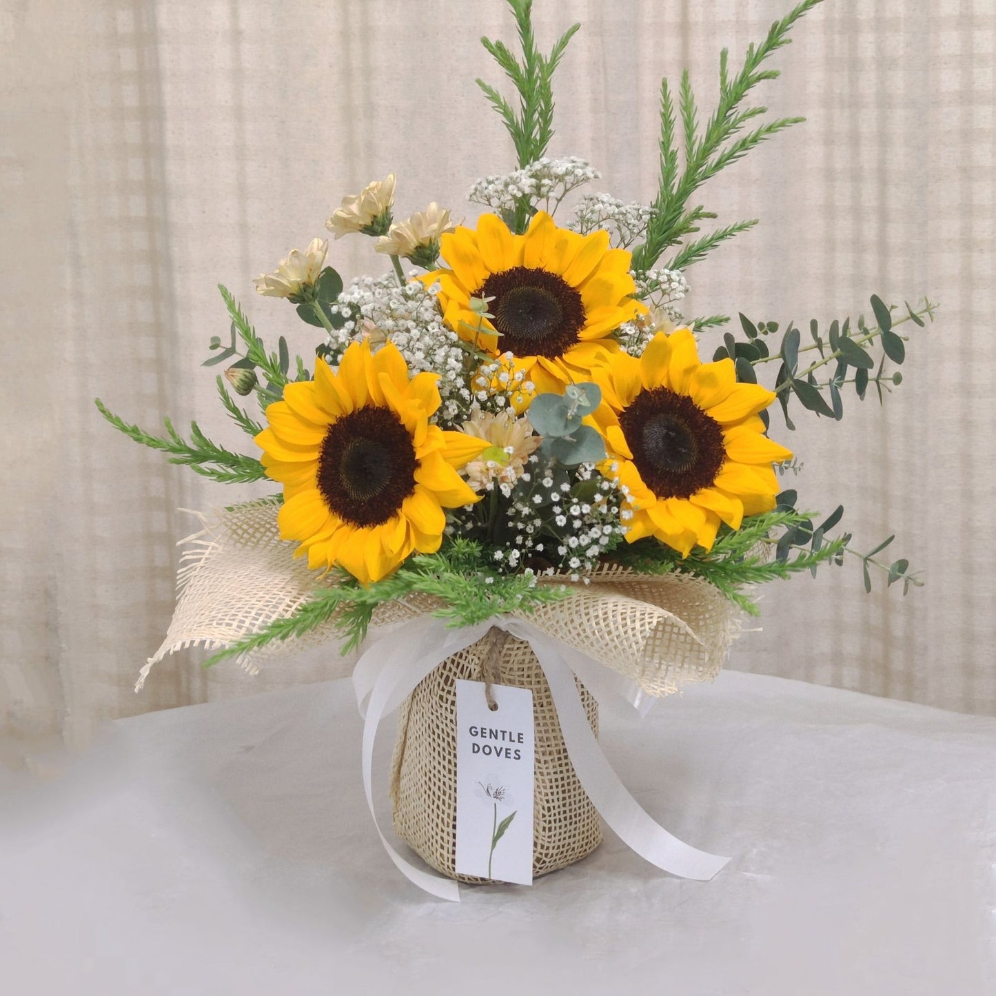 Three Small Sunflowers in Medium Vase Arrangement