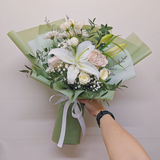 Single Stem Lily with Assorted White Flowers in Green Paper Bouquet