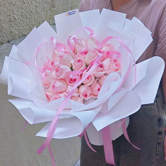 Thirty Soft Pink Roses With Pink Ribbon On in White Paper Bouquet