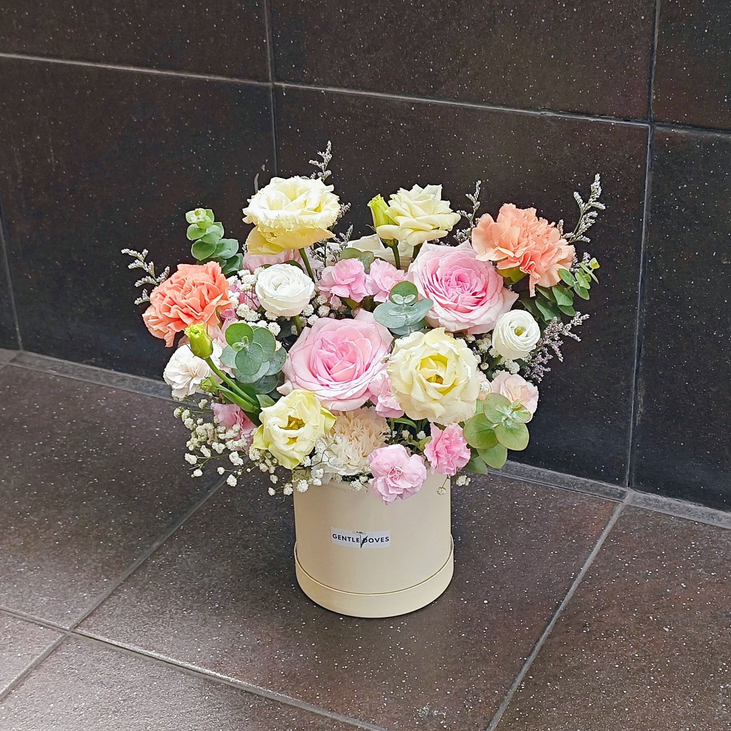 Assorted Pink and Yellow Flowers in Small Paper Box Arrangement